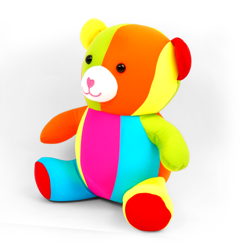 Colorful teddy bear plush toy on a white background