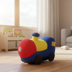 Colorful toy train on a wooden floor in a room with furniture and decor.
