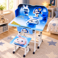 A children's adjustable desk and matching chair set with a cartoon rabbit print, shown in a bright bedroom setting.