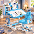 Adjustable children's desk and chair set in light blue and white, styled in a bright, cozy child's bedroom with books, a lamp, and a teddy bear.