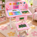 Pink children's desk and matching chair set with colorful educational graphics, shown in a bright nursery or playroom setting.