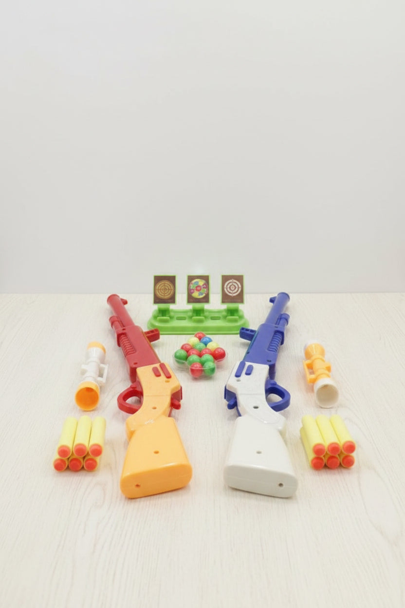 Colorful toy guns and accessories on a light gray background