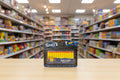 SHOT suction blots packaging on a table with a blurred store shelf background