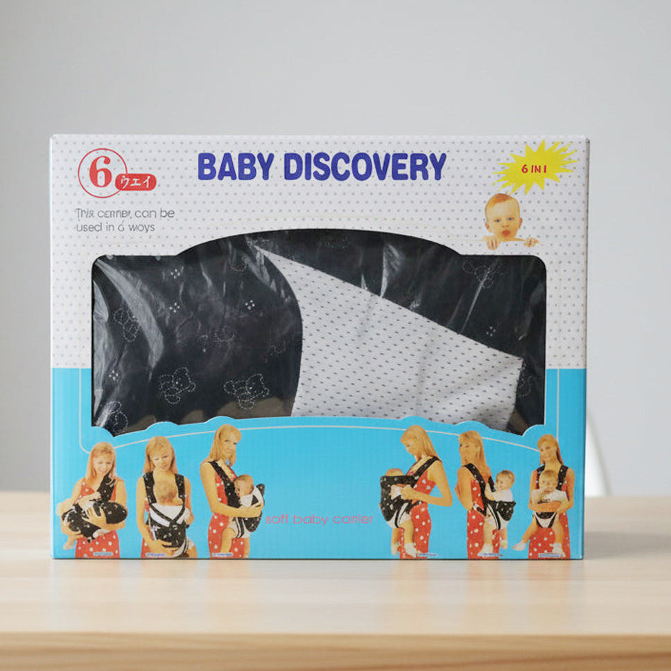 Baby carrier packaging with 'Baby Discovery' branding on a gray background