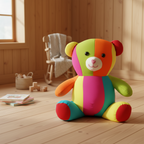 Colorful teddy bear on a wooden floor with a wooden chair and toys in the background