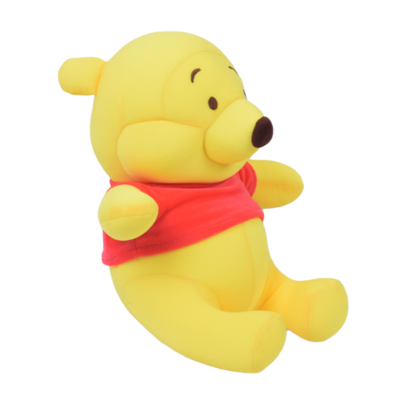 Yellow teddy bear plush toy with a red shirt on a white background