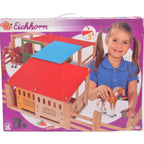 Eichhorn toy horse stable set with a child playing with horses on the packaging.