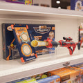 Toy air blaster with packaging on a store shelf