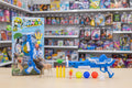 Toy gun and packaging with toy animals on a shelf background