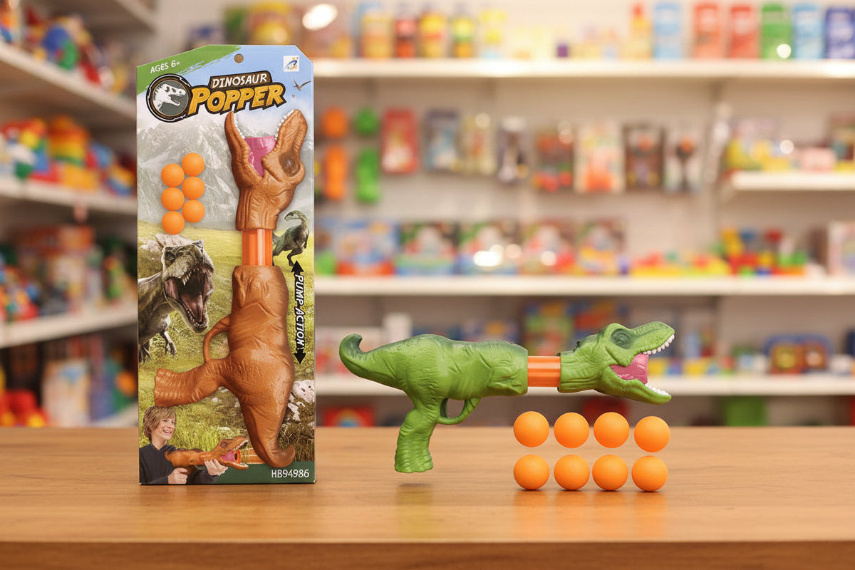 Toy dinosaur popper with packaging on a store shelf background