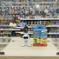 A small white robot toy with blue accents and a black-and-white hovering drone above it, placed on a textured light blue background. The robot has the word 'ONITO' printed on its chest.