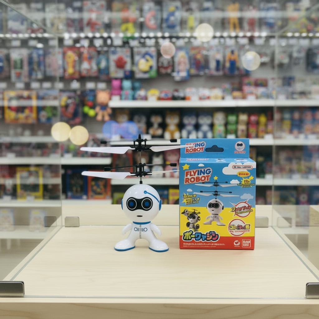 A small white robot toy with blue accents and a black-and-white hovering drone above it, placed on a textured light blue background. The robot has the word 'ONITO' printed on its chest.