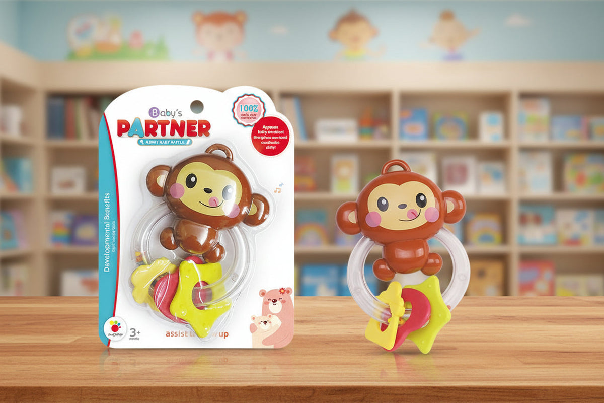 Baby teether with packaging labeled 'Baby's Partner' on a wooden surface with a bookshelf background.