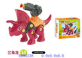 A pink and orange toy triceratops dinosaur with a gray gun mounted on its back, shown next to its retail packaging box. The image also contains text overlays with product codes and dimensions.