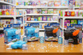 Bubble gun toys on display in a store with shelves in the background
