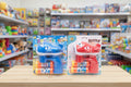 Two bubble guns in packaging on a table with a toy store background