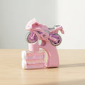 Pink and gray toy bike on a wooden surface with a light gray background