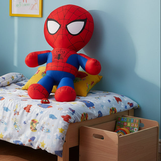 Spider-Man plush toy on a child's bed with colorful bedding and toys.