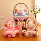 Children's activity centers with plush toys and hanging elements on a wooden floor.