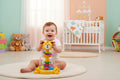 Baby playing with a colorful toy in a nursery room
