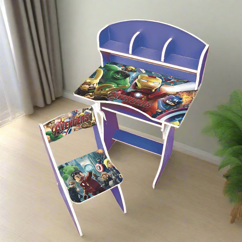 Children's desk and chair set with superhero-themed design on a light wooden floor.