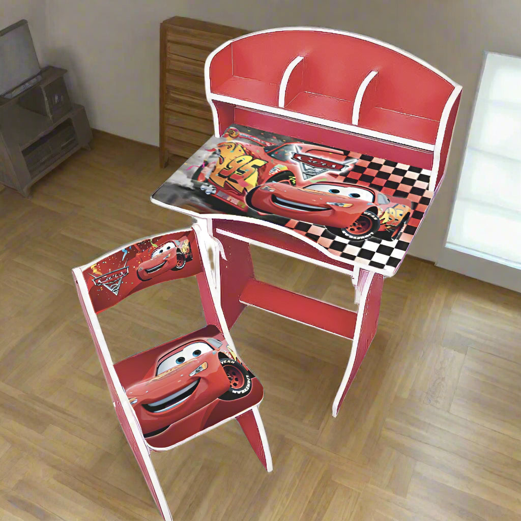 Children's desk and chair set with Disney Cars design on a wooden floor.