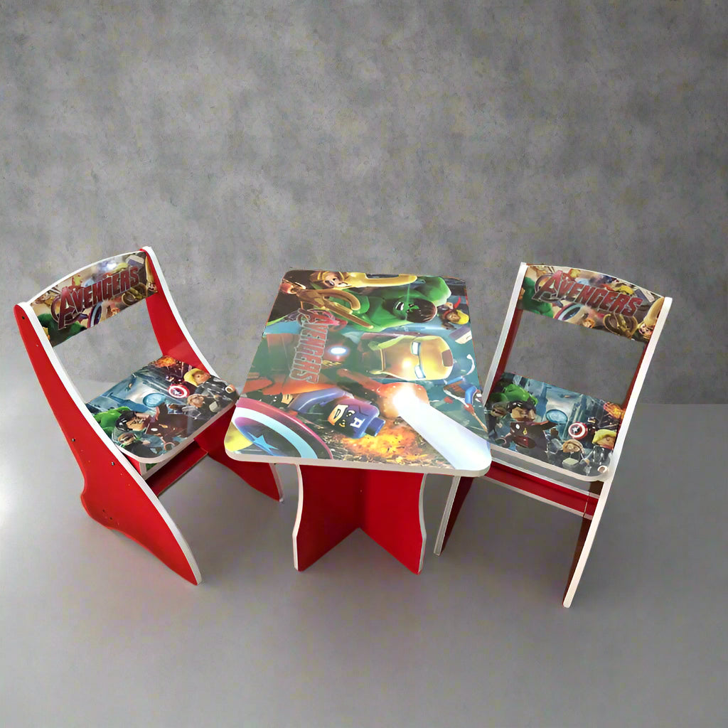 Children's table and chairs set with superhero design on a gray background