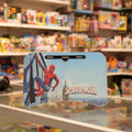 A Spider-Man themed plastic desk divider or stand with a printed graphic of Spider-Man on the left and the 'SPIDER-MAN' logo on the right, displayed on a glass shelf in a toy store.