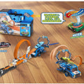 Toy car track set with cars and accessories on a wooden floor