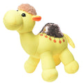 Yellow plush camel toy with a sequined saddle on a white background
