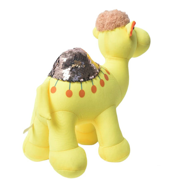 Yellow plush toy with sequin details on a white background