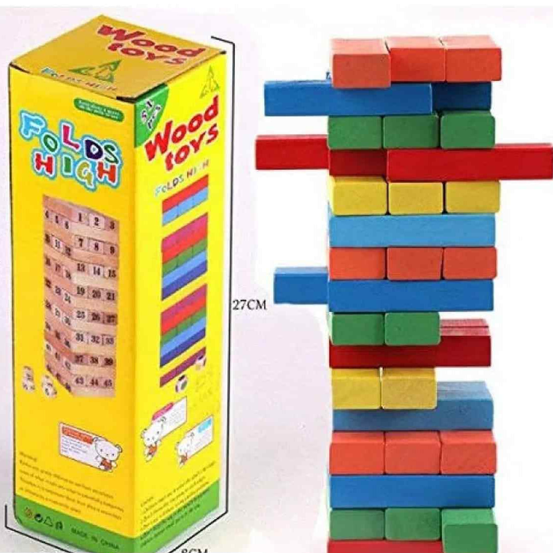 Colorful wooden building blocks with a tower and packaging on a white background