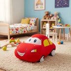 Red plush toy car on a carpeted floor in a child's room with toys and furniture.