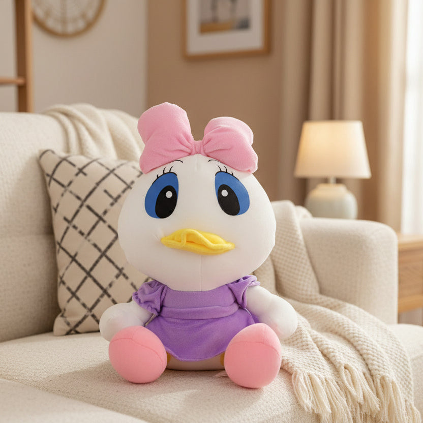 Plush toy resembling a cartoon character with a pink bow on a couch in a living room.