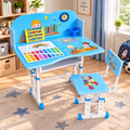 Adjustable children's desk and chair set in a bright room. The set features a light blue and white desk with colorful educational graphics, a matching chair, and a small blue storage box on a patterned rug.